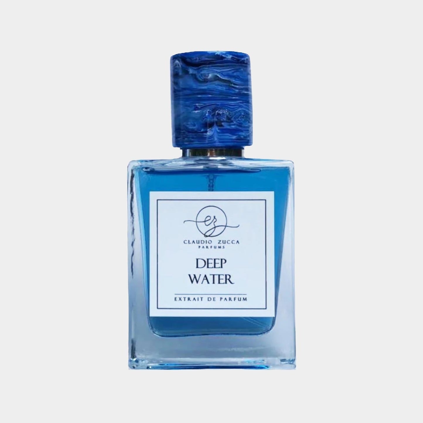 A full bottle of Claudio Zucca Deep Water perfume, featuring a square glass design with a vibrant blue liquid and a textured blue cap. The label prominently displays the fragrance name and brand logo.