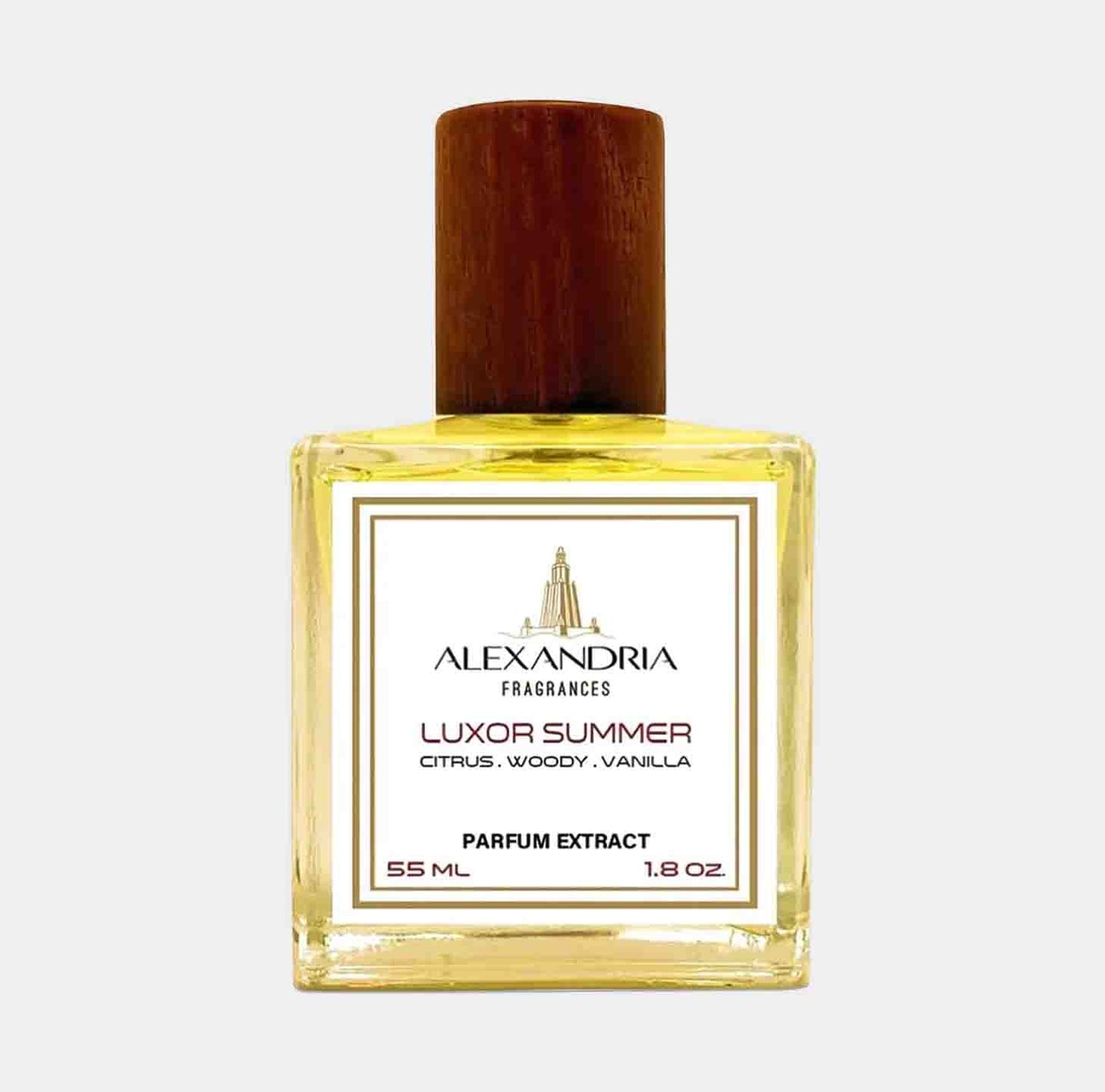 A bottle of Alexandria Fragrances Luxor Summer Sample, a parfum extract with a citrus, woody, and vanilla scent, featuring a wooden cap and labeled design.