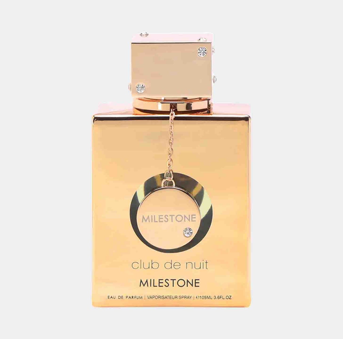 A sample bottle of Armaf Club de Nuit Milestone EDP, featuring an elegant gold design with a textured cap and a decorative circle pendant. The bottle is labeled with Milestone and club de nuit.