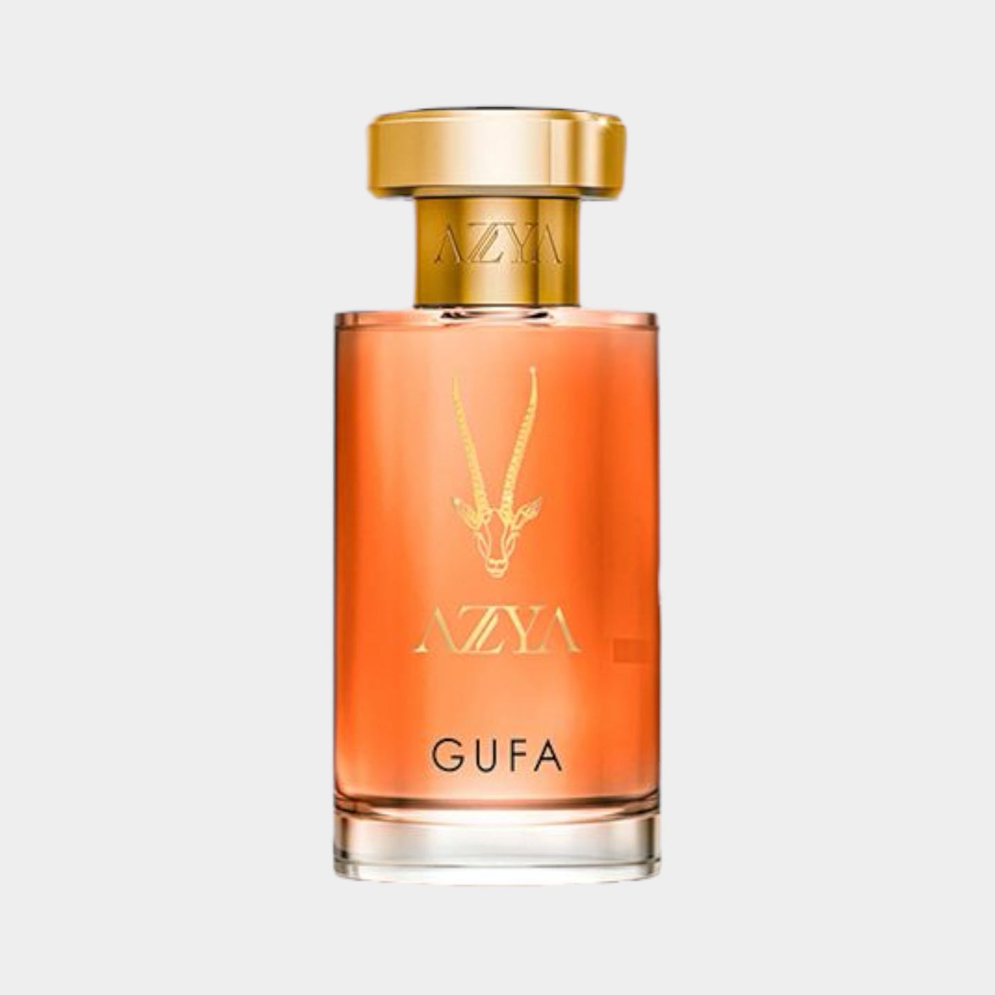 A sleek bottle of Azya Gufa Sample fragrance, featuring an elegant design with a gold cap and a soft amber liquid inside. The bottle is adorned with the Azya logo and a decorative antelope motif.