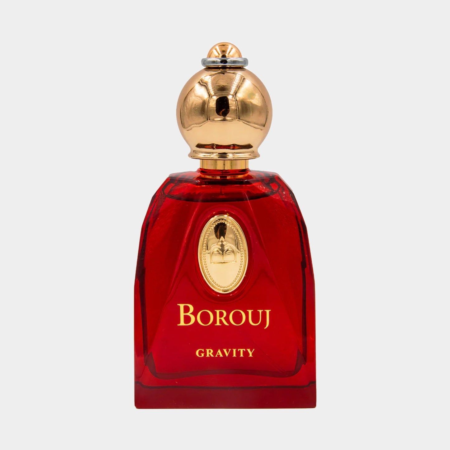 A luxurious glass perfume bottle of Borouj Gravity, featuring a bold red color and a gold cap, elegantly showcasing its sophisticated design.