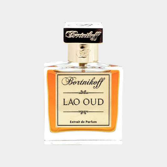 A small bottle of Bortnikoff Lao Oud Extrait de Parfum, featuring an elegant design with a gold label against a clear glass container, showcasing a rich amber liquid inside.
