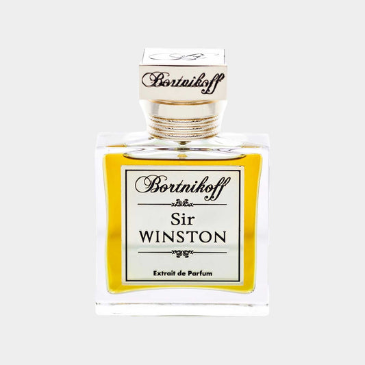 A clear glass bottle of Bortnikoff Sir Winston Sample perfume, featuring an elegant design with a gold cap and a label that reads Sir WINSTON and Extrait de Parfum in decorative font.