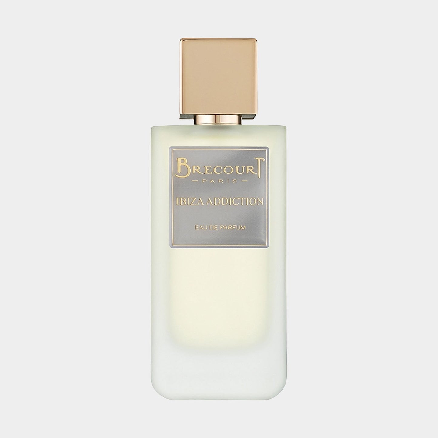 A full bottle of Brecourt Ibiza Addiction, featuring a sleek, minimalist design with a light frosted glass body and a gold-toned cap. The label elegantly displays the brand name and fragrance title in sophisticated lettering.