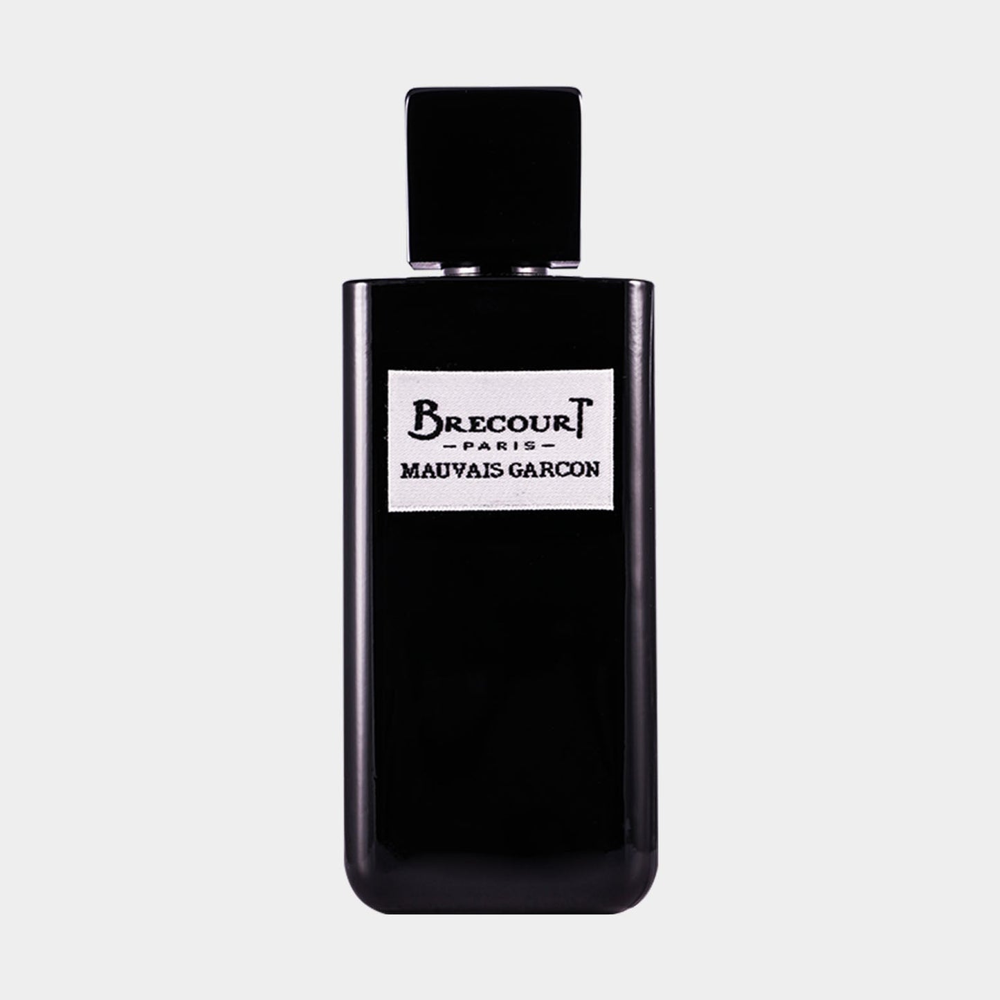 Black rectangular bottle of Brecourt Mauvais Garcon Sample perfume, featuring a minimalist design with a label that displays the brand name and fragrance title.