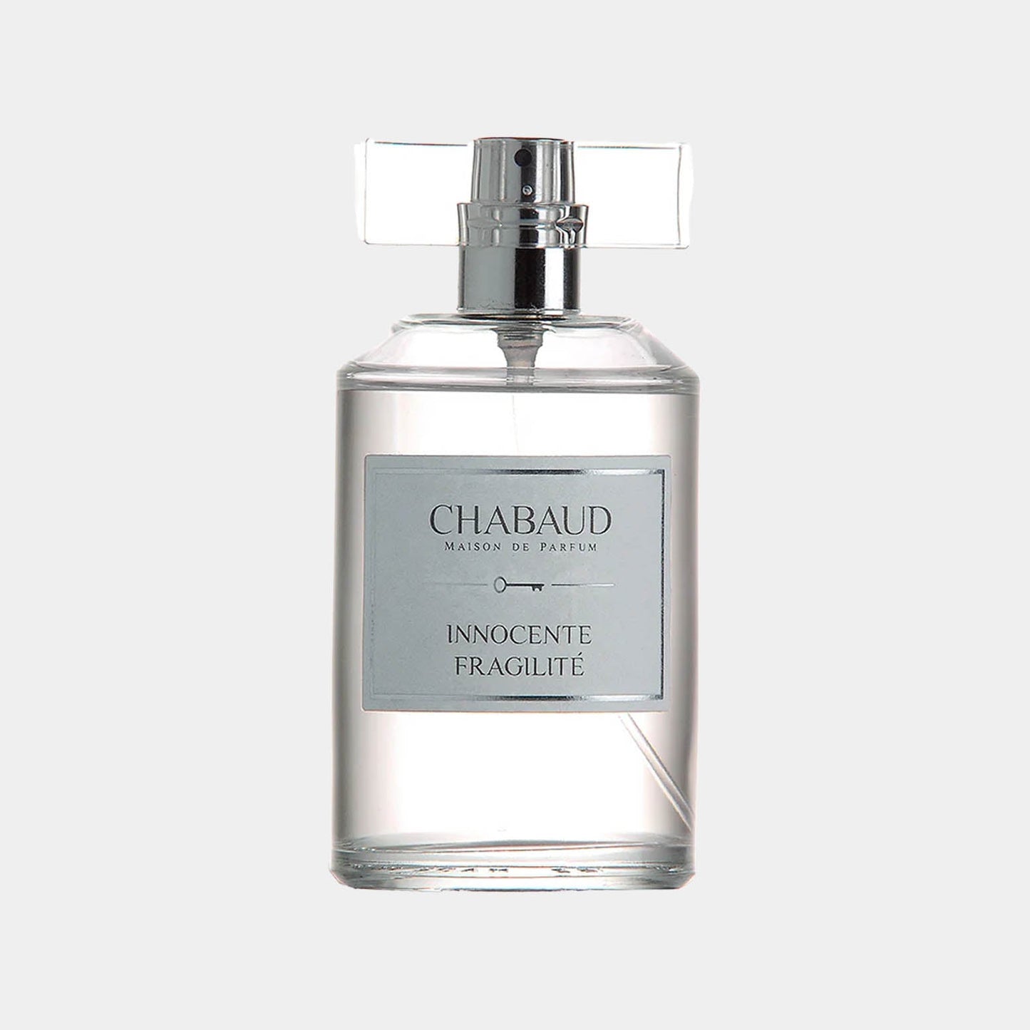 Chabaud Maison de Parfum Innocente Fragilité Sample is a sleek glass perfume bottle featuring a minimalist design, with a silver label and a decorative cap. The fragrance is known for its delicate and airy scent profile.
