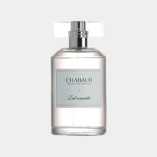 A clear glass bottle of Chabaud Maison de Parfum Lait Concentre EDT Sample, featuring a minimalist label and a sleek design. The bottle is designed for easy display and sampling of the fragrance.