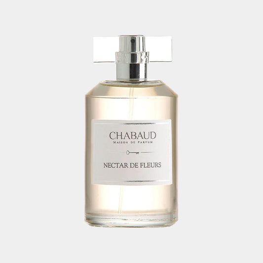 A sample bottle of Chabaud Maison de Parfum Nectar de Fleurs, featuring a sleek design with a silver cap and a clear label. The fragrance is delicately showcased in a transparent bottle, capturing the essence of floral notes.