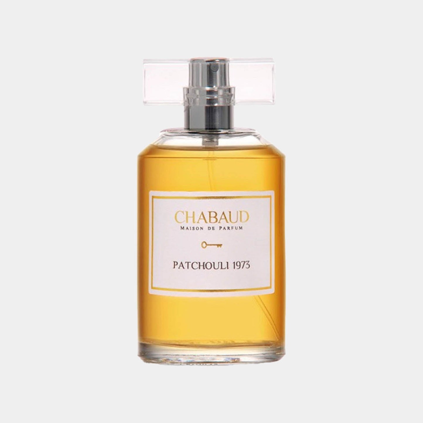 A sample bottle of Chabaud Maison de Parfum Patchouli 1973, featuring an elegant design with a clear glass container and a classic label, showcasing a warm golden fragrance.