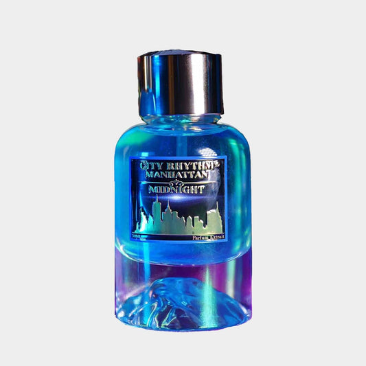A full bottle of City Rhythm Manhattan Midnight perfume, featuring a sleek glass design with a gradient of blue and purple hues, topped with a silver cap and adorned with a label showcasing the city skyline.