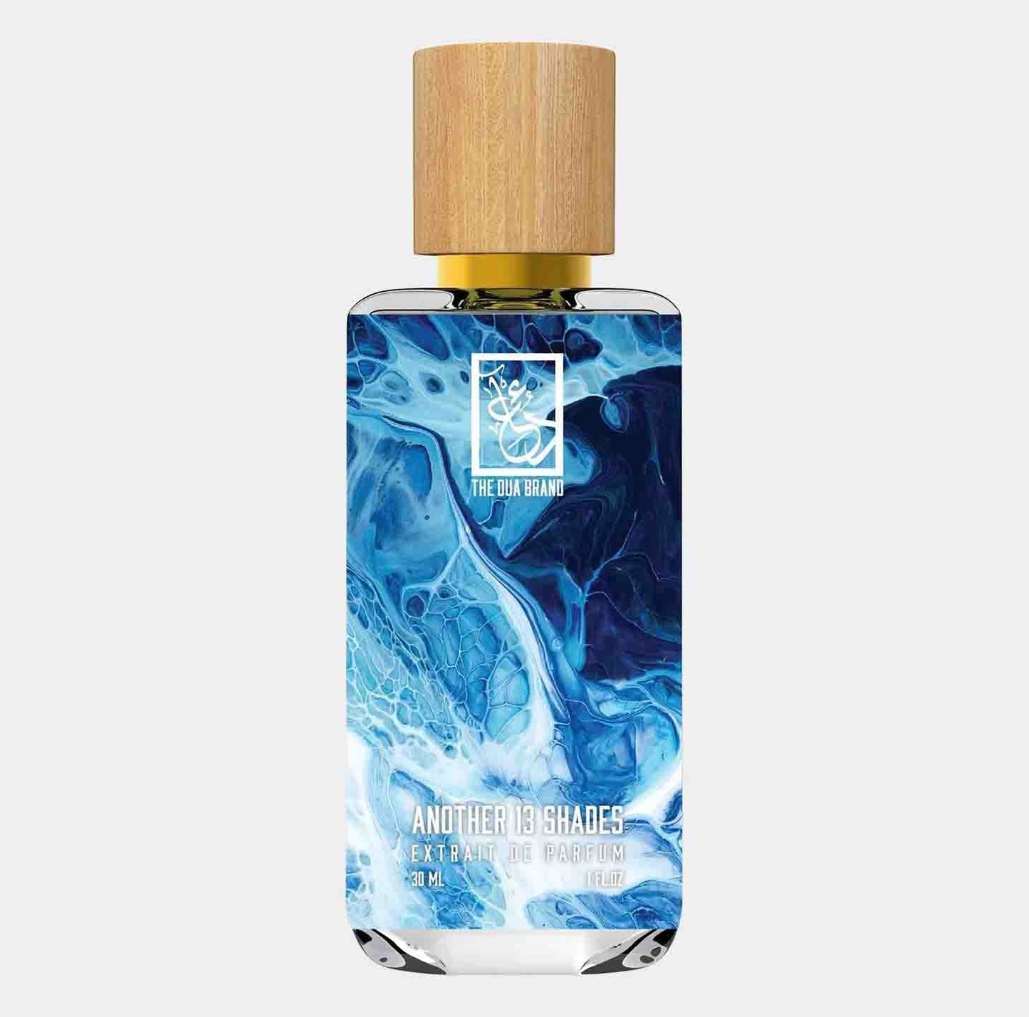 A bottle of Dua Another 13 Shades Sample, featuring a sleek design with a blue marble pattern and a wooden cap, containing 30ml of extrait de parfum.