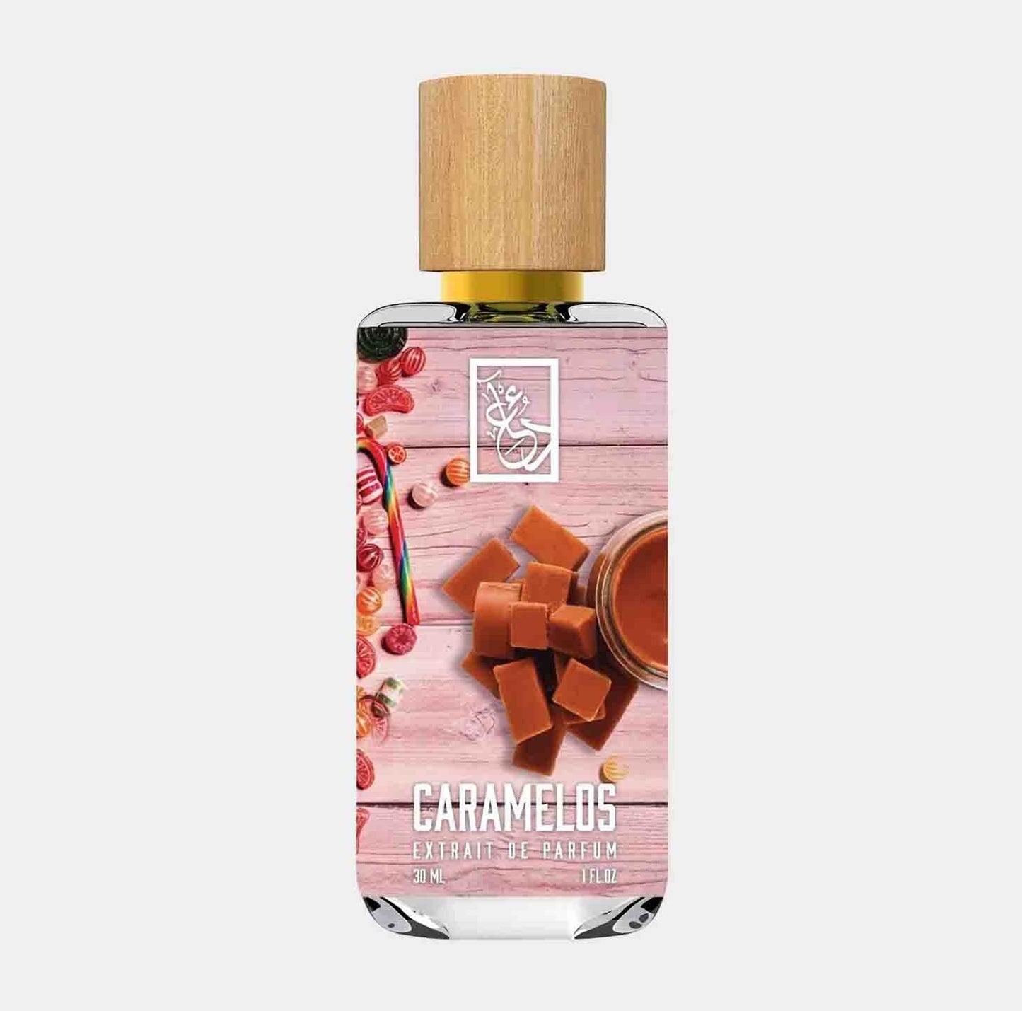 Dua Caramelos Sample fragrance bottle featuring a wooden cap, set against a backdrop of caramel candies and sauce, showcasing its sweet and indulgent scent.