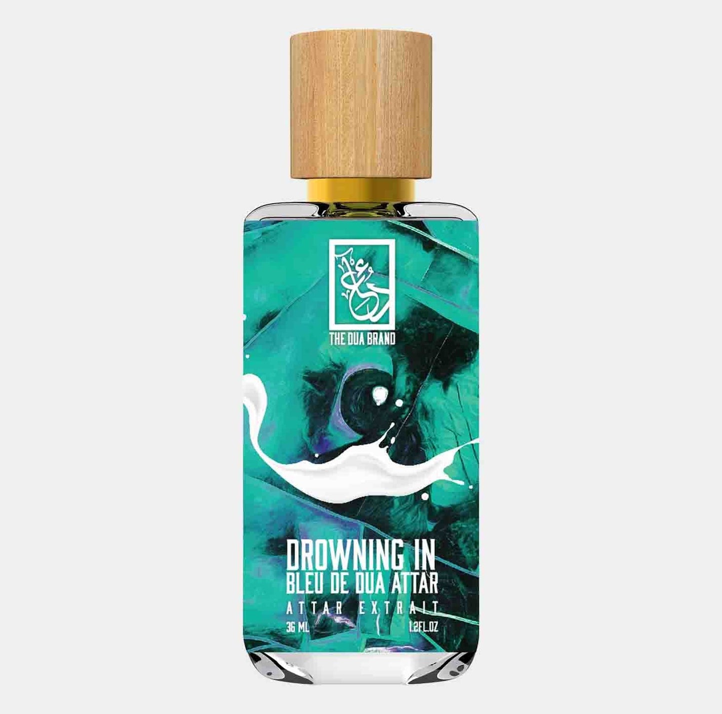 A stylish bottle of Dua Drowning in Bleu de Dua Attar, featuring a wooden cap and a vibrant turquoise design. The 36 ml attar exudes an exotic fragrance, showcasing the essence of the brand.