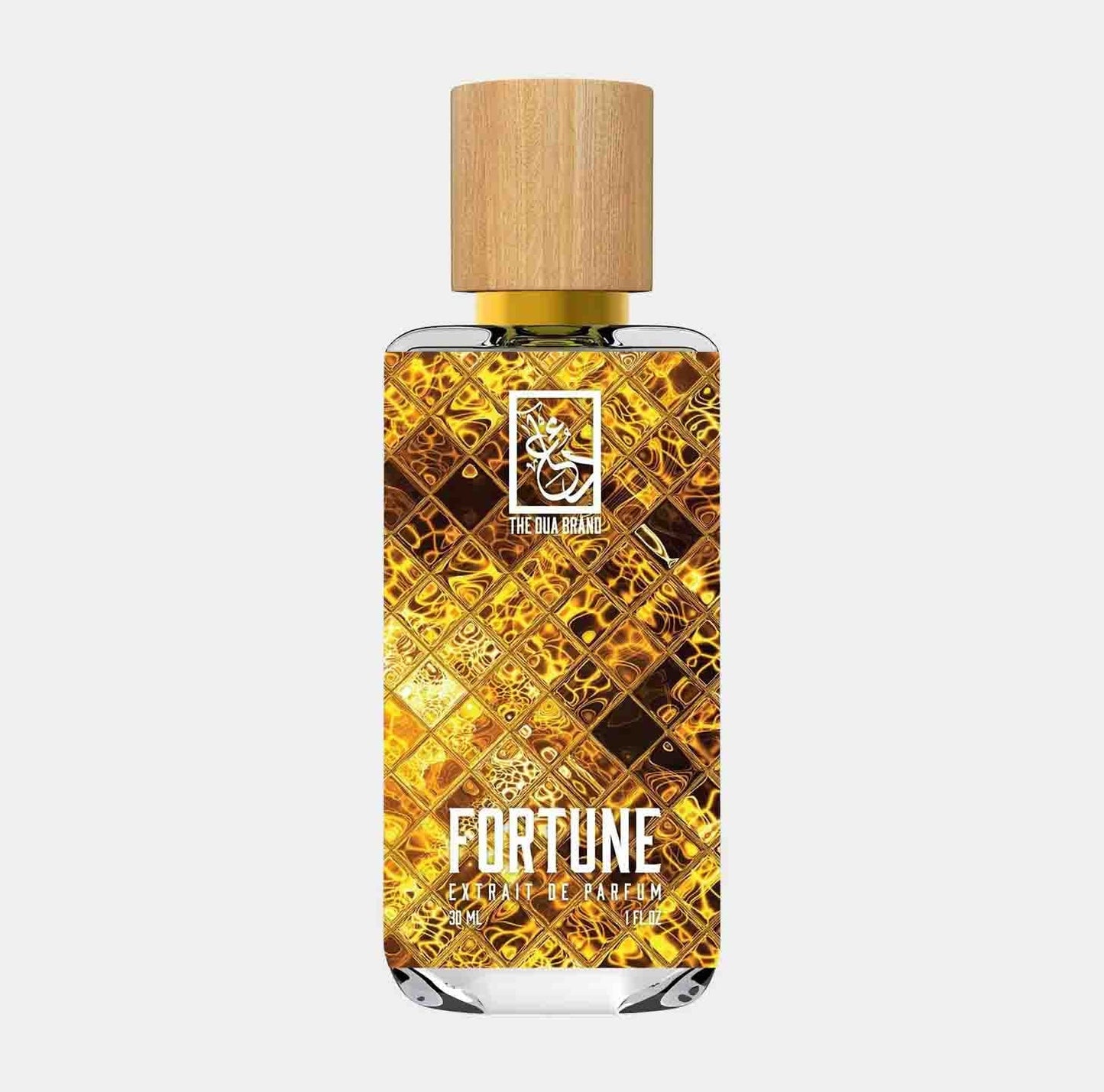 A bottle of Dua Fortune Sample perfume, featuring a decorative golden design and a natural wooden cap. The label prominently displays the name Fortune in an elegant font.