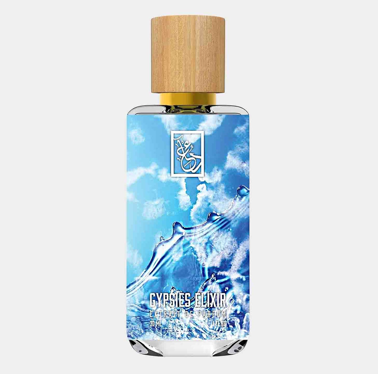 Dua Gypsies Elixir Sample is a beautifully designed fragrance bottle featuring a natural wood cap, with the vibrant blue liquid inside symbolizing freshness and vitality. The sleek packaging showcases the brand's elegant logo against a background reminiscent of water waves.