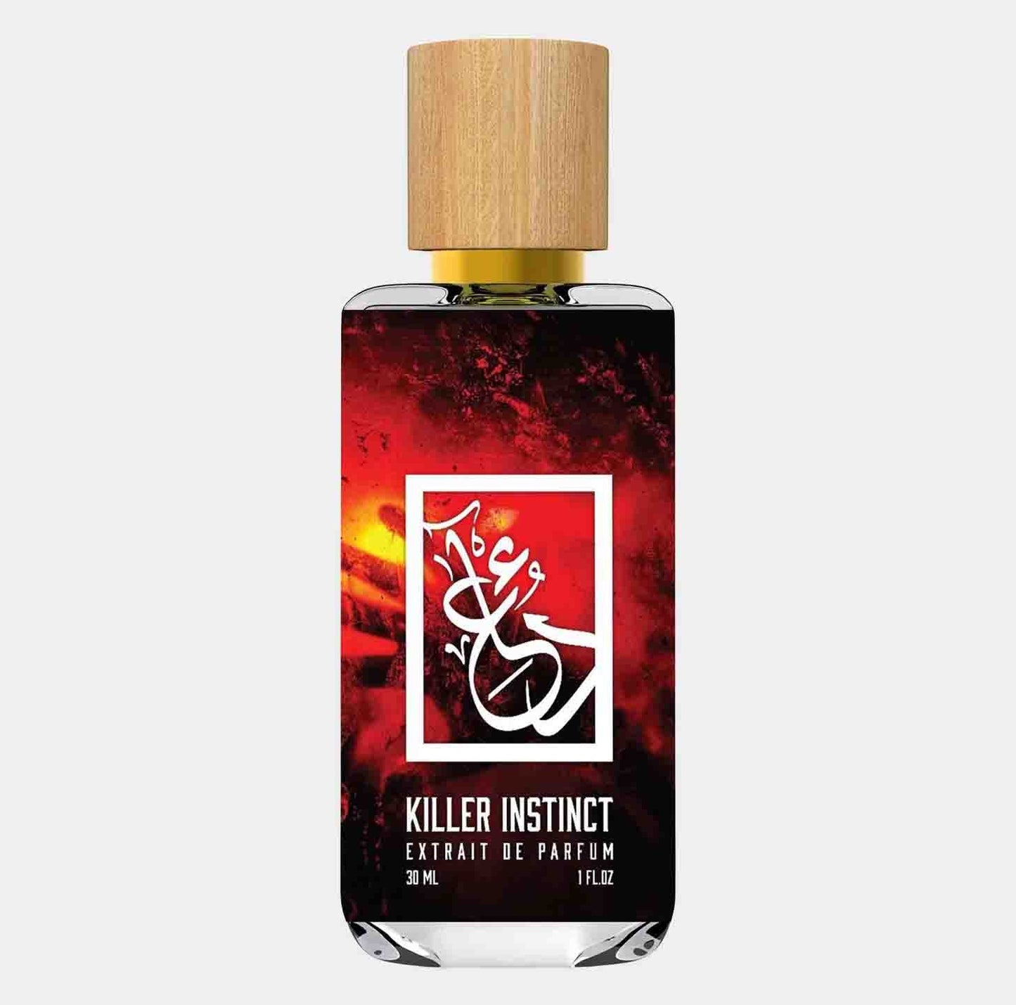 A bottle of Dua Killer Instinct perfume, featuring an elegant design with a wooden cap and a striking red and black label, showcasing the brand's logo and product name. The bottle contains 30 ml of extrait de parfum.