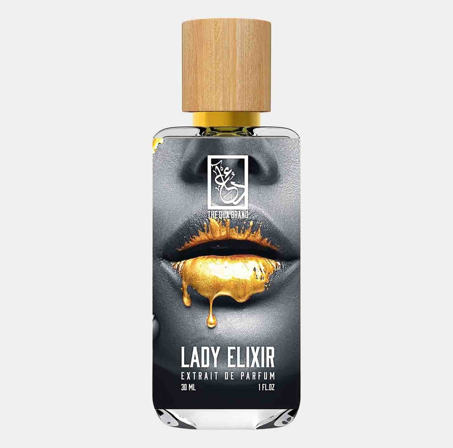 A sleek 30 ml bottle of Dua Lady Elixir Sample, featuring a stylish design with golden accents on a black and white background, highlighting the luxurious fragrance inside. The wooden cap adds a touch of elegance to the overall presentation.