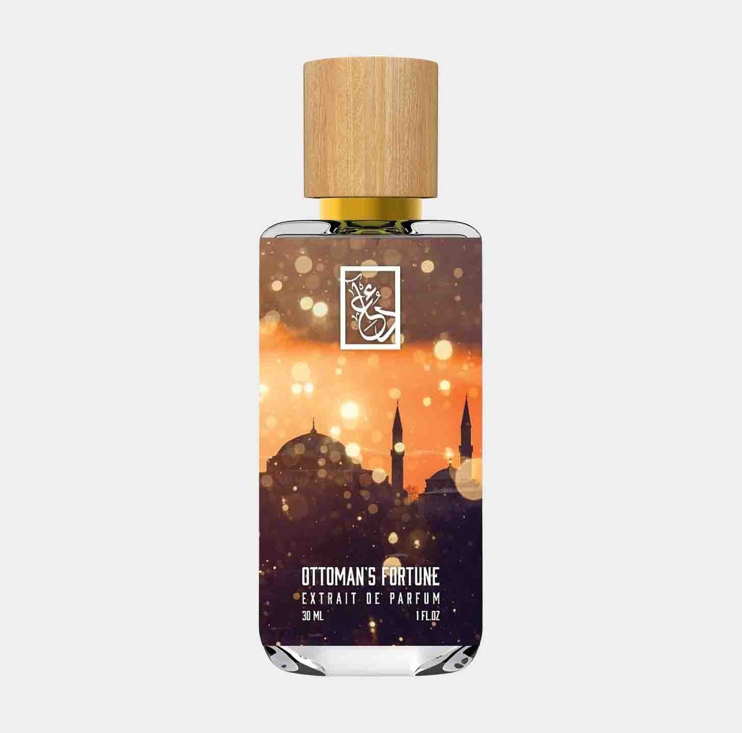 Dua Ottoman's Fortune Sample, a 30ml extrait de parfum in a clear bottle with a wooden cap, featuring a design of a silhouette of a mosque against a golden, festive background.