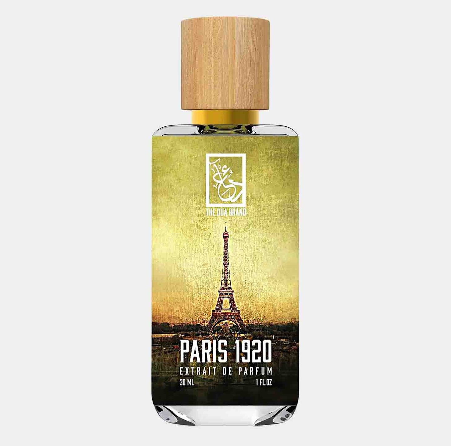 A bottle of Dua Paris 1920 Sample, featuring a sleek design with a wooden cap and an artistic label depicting the Eiffel Tower against a vintage background. The bottle contains 30 mL of extrait de parfum.