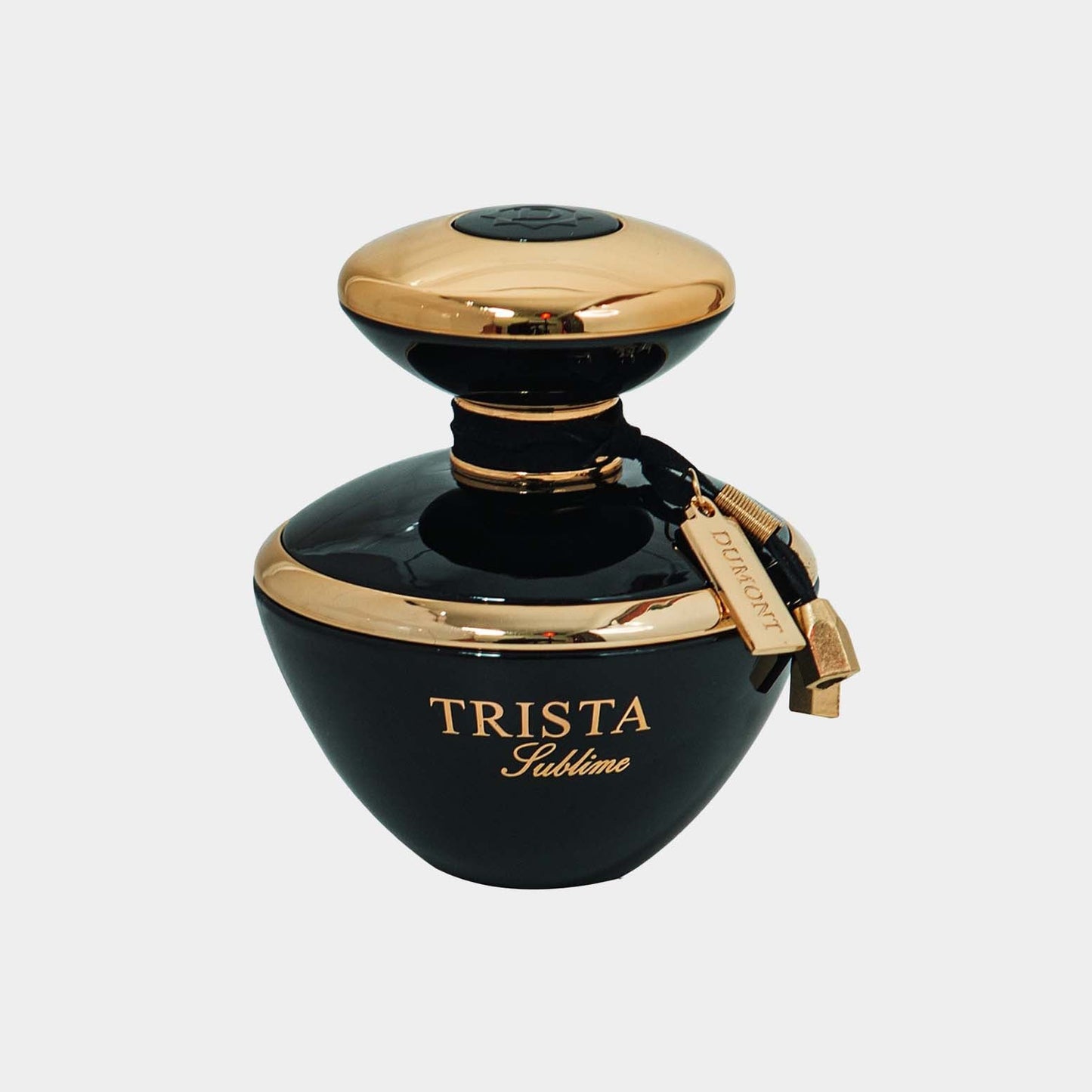 Trista Sublime Sample is an elegant black perfume bottle with a gold accent and a decorative tag, showcasing a luxurious design.