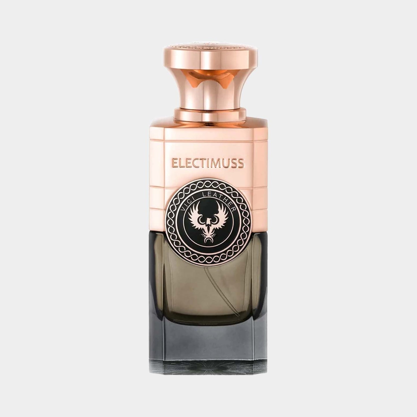 A full bottle of Electimuss Vici Leather fragrance, featuring a sleek, elegant design with a dark ombre effect and a distinctive emblem on the front. The bottle is topped with a stylish rose gold cap.