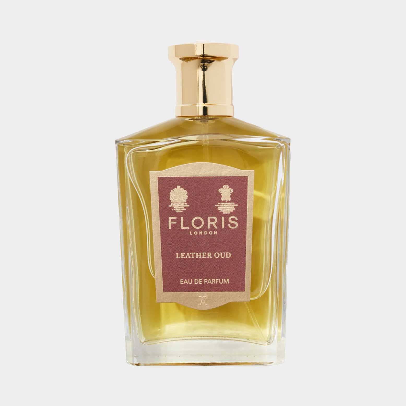 Floris London Leather Oud Sample is an elegant glass bottle of perfume featuring a rich golden liquid, with a sophisticated label highlighting its luxurious scent profile. This Eau de Parfum embodies a blend of leather and oud, perfect for fragrance enthusiasts.