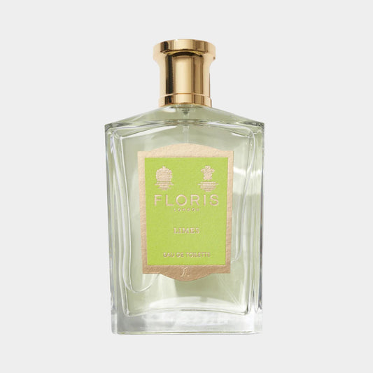 A clear glass bottle of Floris London Limes Sample, featuring a gold cap and a green label, containing Eau de Toilette. The elegant design highlights the luxurious fragrance inside.