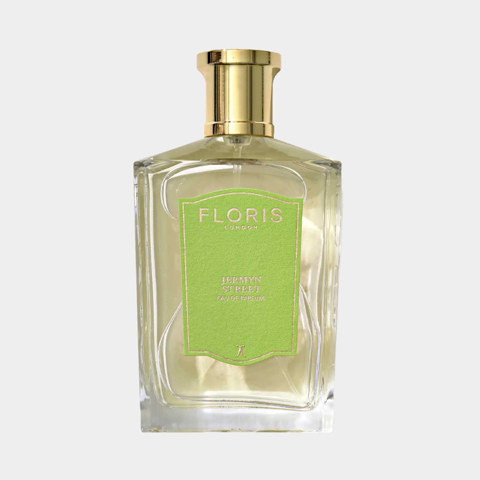 A glass bottle of Floris London Jermyn Street Sample fragrance, featuring a sleek design and a green label, showcasing its luxurious and elegant appeal.