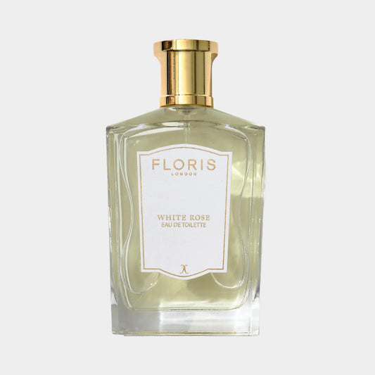 Floris London White Rose Sample is an elegant glass bottle of eau de toilette, featuring a gold cap and a label with a delicate floral design.