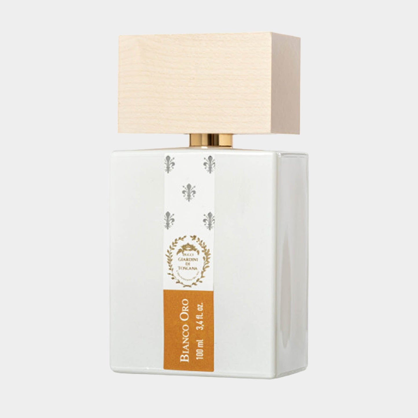 A full bottle of Giardini di Toscana Bianco Oro, featuring a sleek white body and a light wooden cap, measuring 100 ml (3.4 fl oz). The elegant design showcases a golden label, emphasizing its luxurious appeal.