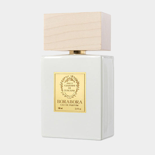 A sleek, elegant perfume bottle from Giardini di Toscana, labeled BoraBora Sample, featuring a wooden cap and a minimalist design. The bottle holds 100 ml of fragrance, showcasing a refined aesthetic.