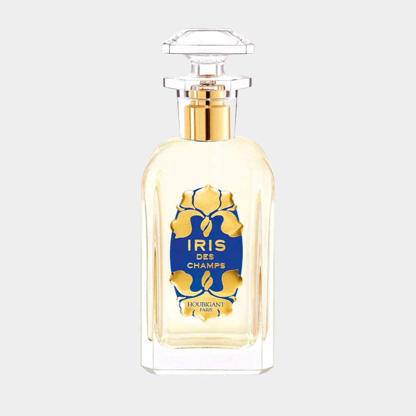 Houbigant Iris des Champs sample, featuring a clear glass bottle with a blue and gold label, elegantly topped with a crystal-like cap, showcasing the fragrance inside.