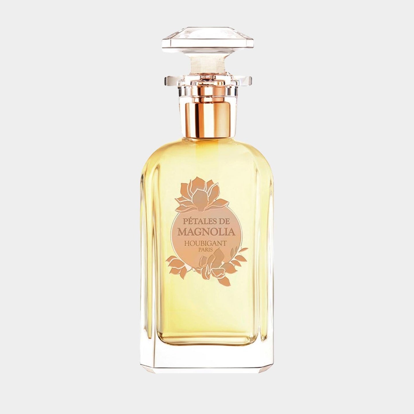 A sample bottle of Houbigant Pétales de Magnolia perfume, featuring an elegant glass design and a floral label. The fragrance has a soft yellow hue, evoking the essence of magnolia petals.