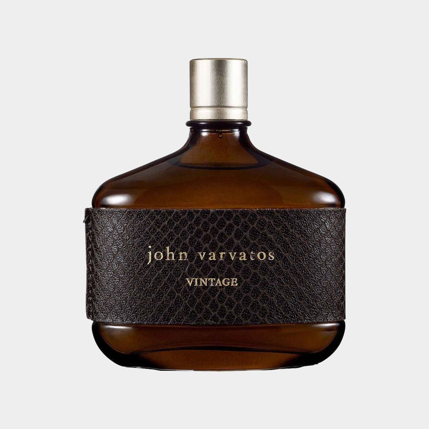 A stylish brown glass bottle of John Varvatos Vintage Sample, featuring a textured leather sleeve with the brand name elegantly embossed in gold.