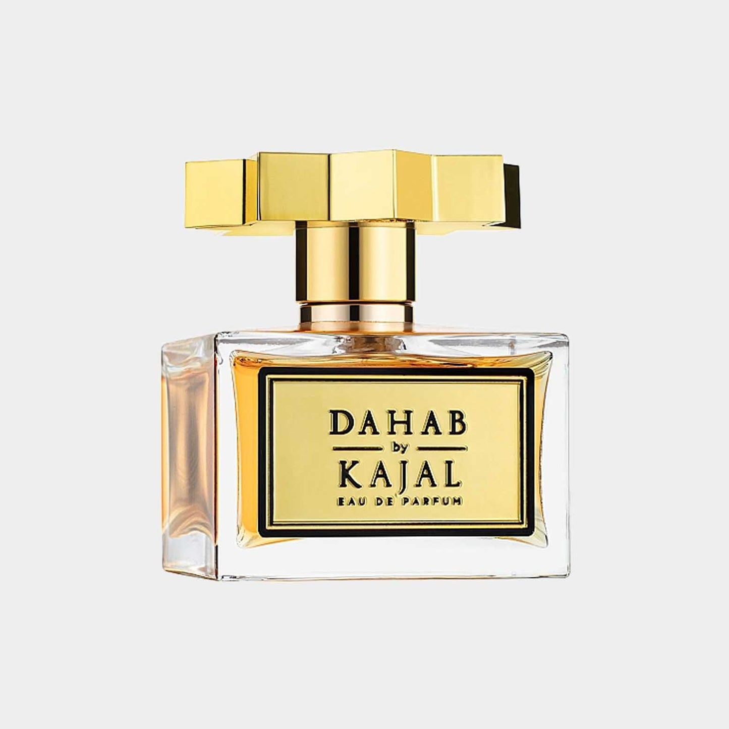 A full bottle of Kajal Dahab Eau de Parfum, featuring an elegant glass design with a gold and black label and a distinctive gold cap.