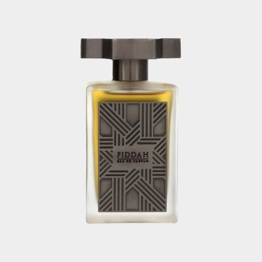 A sleek glass perfume bottle with a geometric patterned cap, showcasing the 'Kajal Fiddah Sample' Eau de Parfum, a luxurious fragrance.