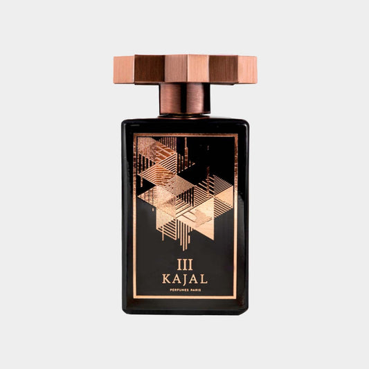 A sleek black perfume bottle adorned with a geometric design in gold and copper, labeled Kajal III Sample. The bottle features a unique square cap, exuding elegance and sophistication.
