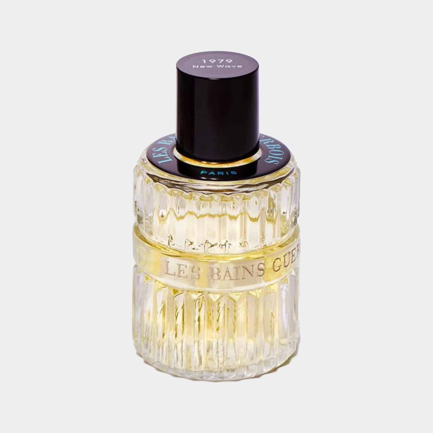 A full bottle of Les Bains Guerbois New Wave 1979 perfume, featuring a textured glass design and a black cap, elegantly labeled with the brand name and year.