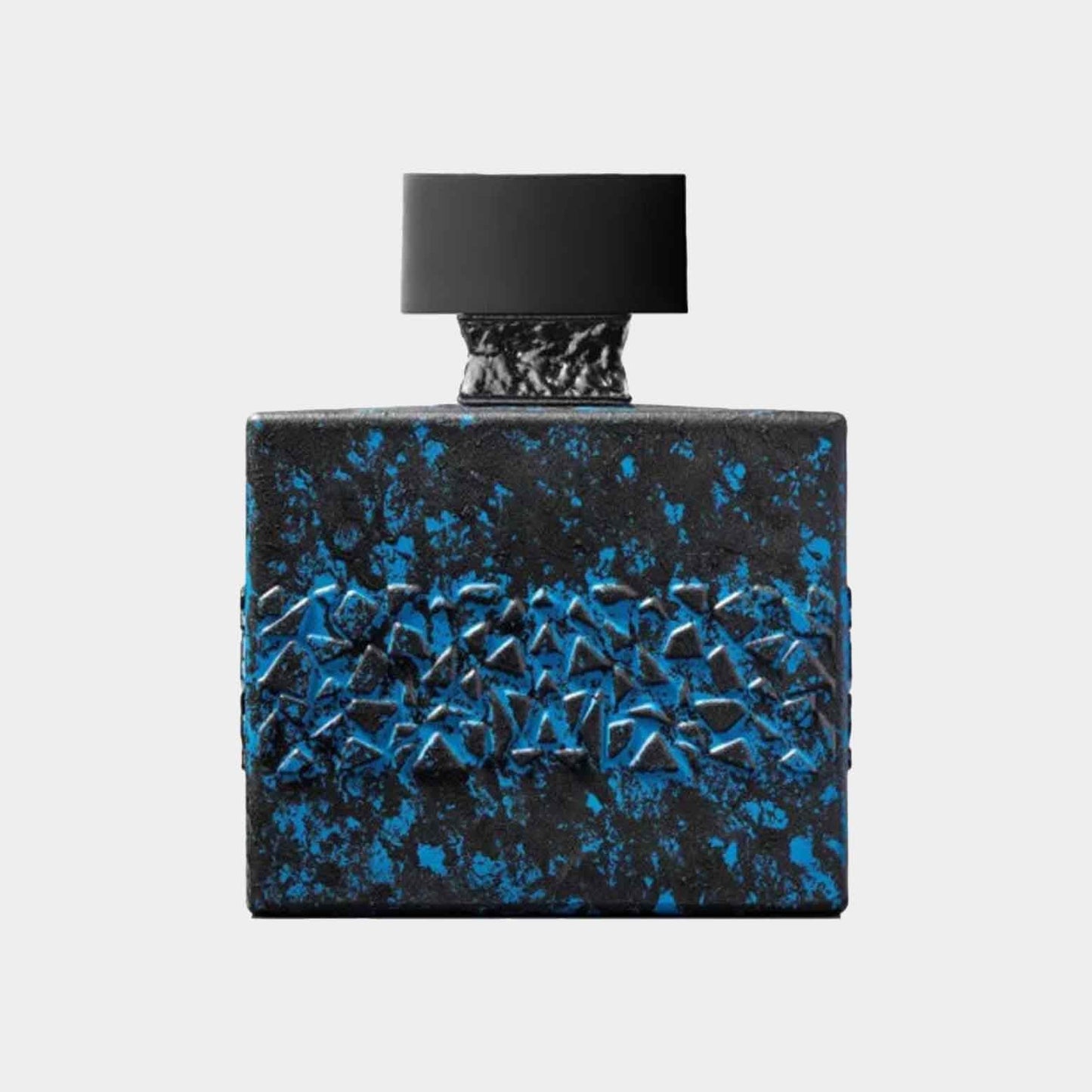 A full bottle of M. Micallef DesirToxic L'Intense perfume, featuring a striking black bottle with a textured blue design and a black cap.