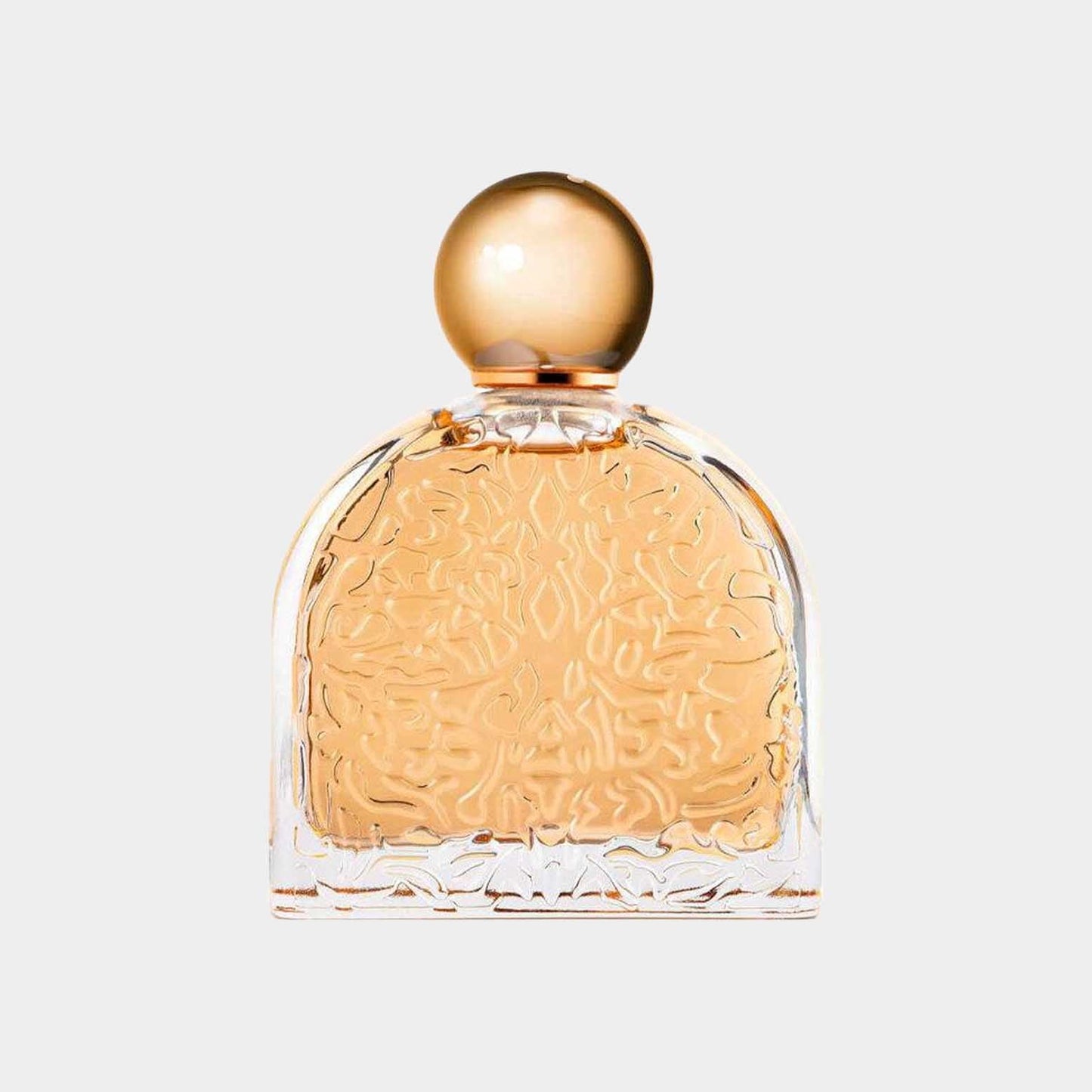 A full bottle of M. Micallef Ô Féminin perfume, featuring a beautifully ornate glass design with a golden spherical cap and amber liquid inside.