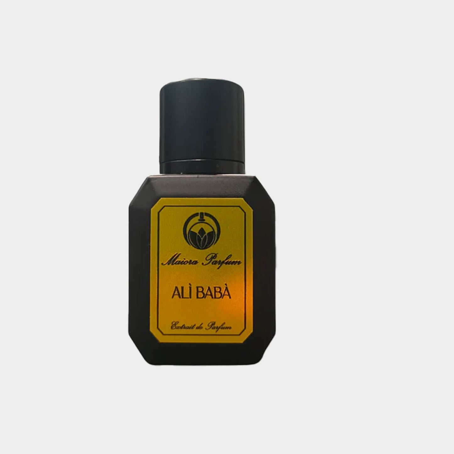 Small black bottle of Maiora Alì Babà Sample perfume, featuring a gold label with the name Ali Babà prominently displayed, representing a rich, exotic fragrance.