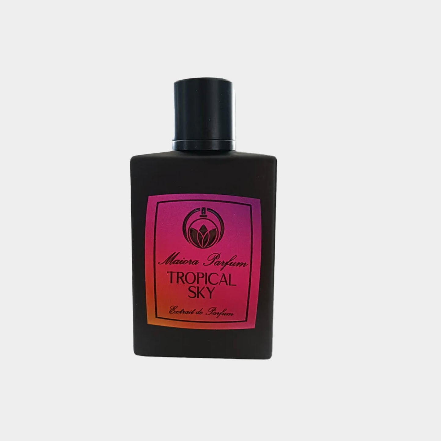 A sleek black bottle of Maiora Tropical Sky Sample perfume, featuring a vibrant pink and purple label with elegant text. The bottle has a simple, modern design that emphasizes the fragrance's tropical essence.