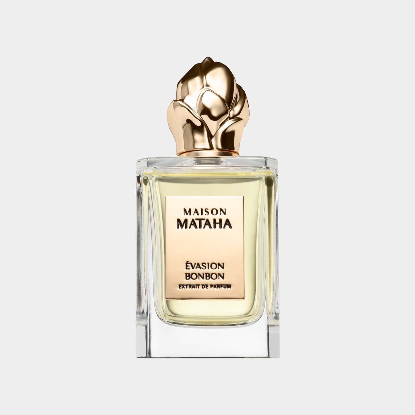 Maison Mataha Évasion Bonbon Sample perfume in a clear glass bottle topped with a gold floral cap, showcasing its elegant and luxurious design.