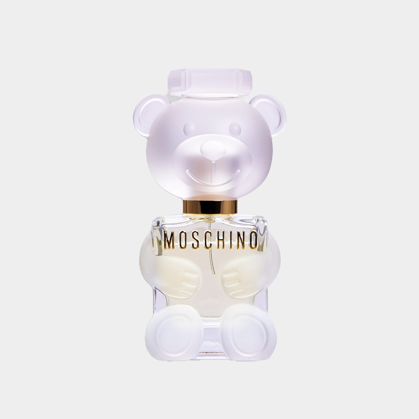A bottle of Moschino Toy 2 Sample perfume, designed in the shape of a friendly bear, featuring a frosted finish and a gold accent at the neck. The transparent base showcases the fragrance inside.
