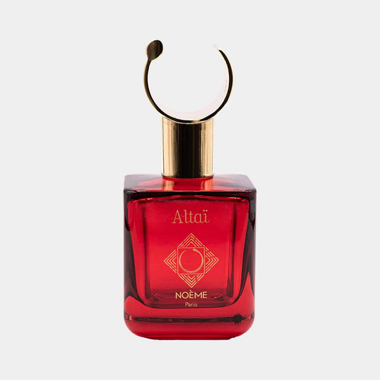A luxurious Noème Paris Altaï full bottle featuring a square red glass design with a gold cap and a distinctive circular handle, exuding elegance and sophistication.