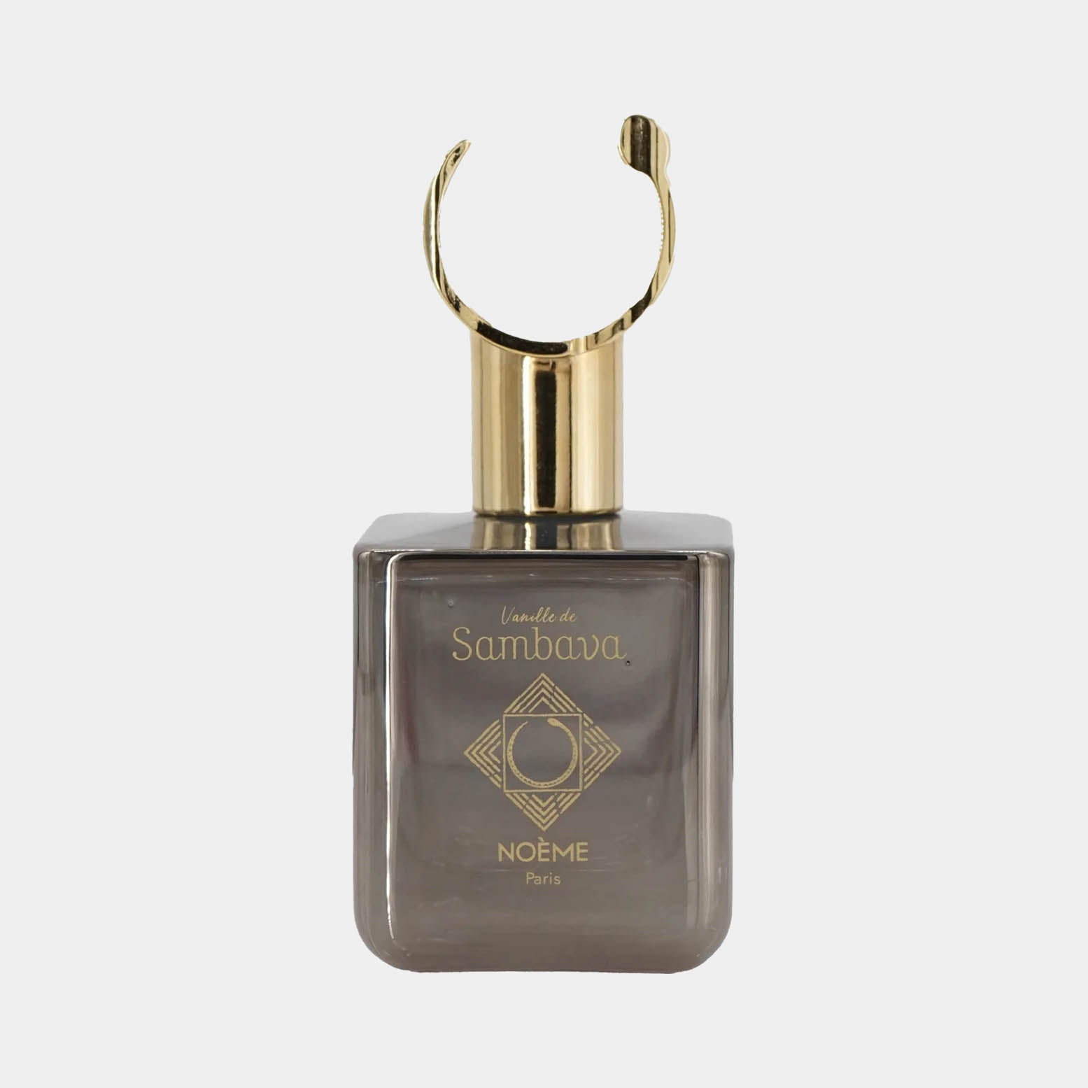 A sleek, square glass bottle of Noème Paris Vanille de Sambava perfume, featuring a gold cap and elegant geometric design on the front. The bottle has a muted gray tint, adding to its sophisticated aesthetic.