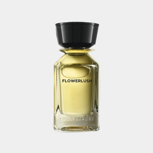 A glass perfume bottle of Omanluxury Flowerlush Sample, featuring a sleek design and a black cap, with the name FLOWERLUSH elegantly displayed on the front.