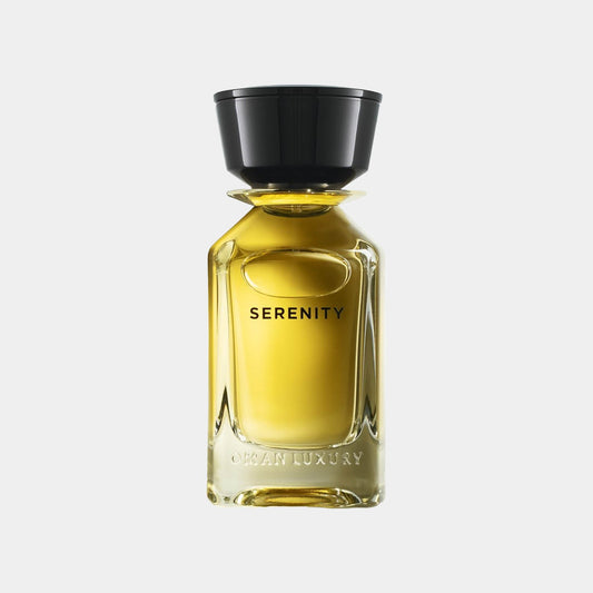A sleek, elegant bottle of Omanluxury Serenity Sample perfume, featuring a golden liquid and a black cap, designed for a luxurious fragrance experience.