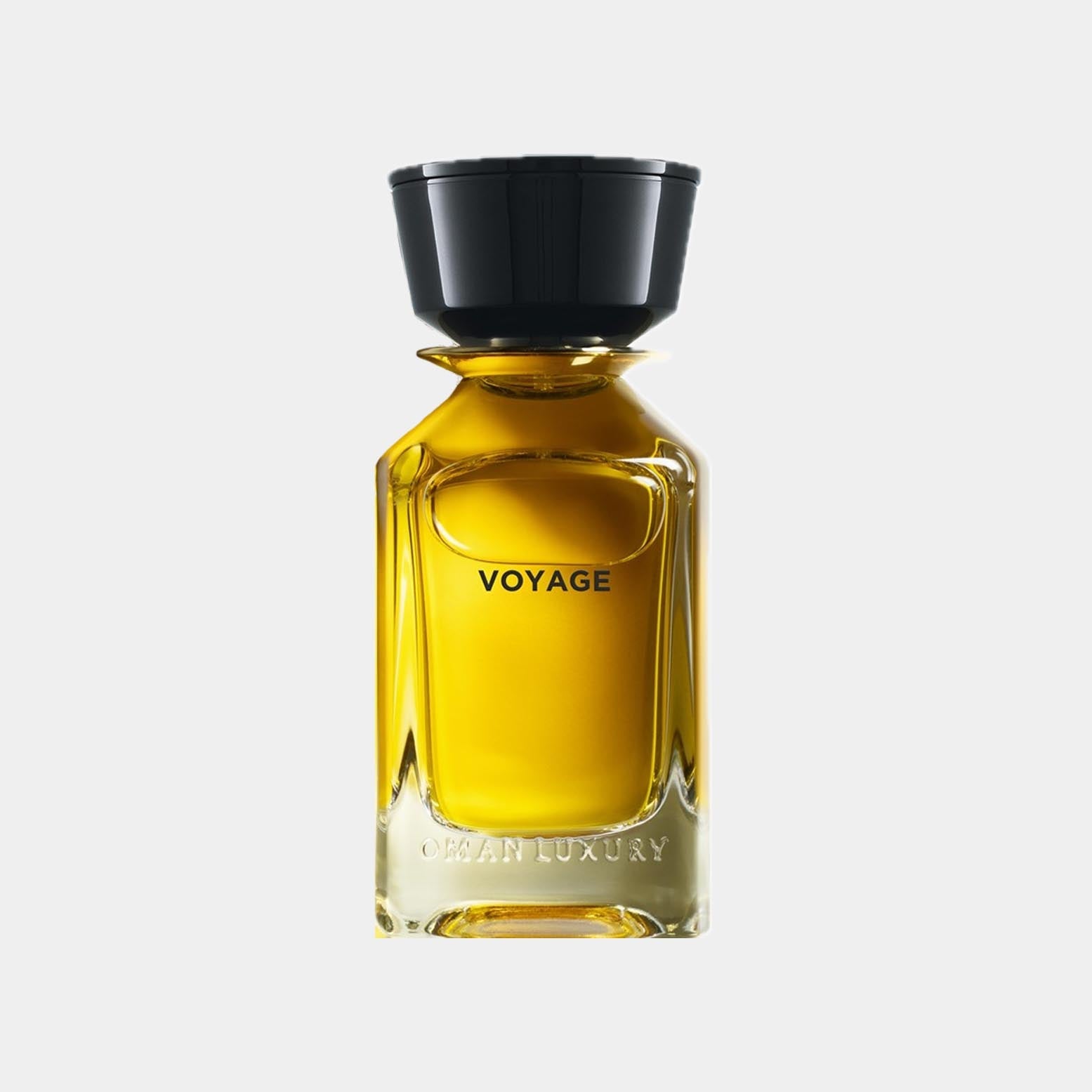 A luxurious bottle of Omanluxury Voyage Sample perfume, featuring a sleek, contemporary design with a black cap and a golden-yellow liquid inside.