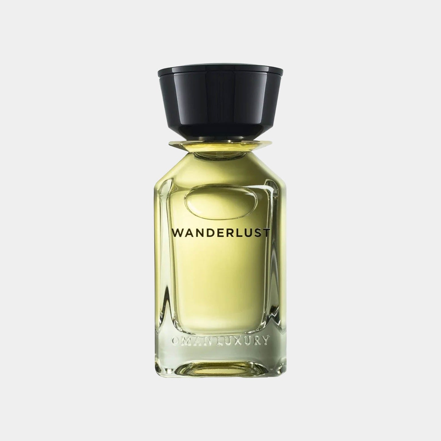 A sleek glass bottle of Omanluxury Wanderlust Sample perfume, featuring a black cap and elegant label, exuding sophisticated allure.